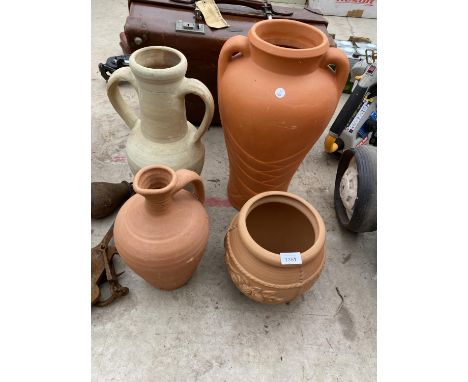 A TERRACOTTA PLANTER, A TERRACOTTA JUG AND TWO TERRACOTTA URNS 