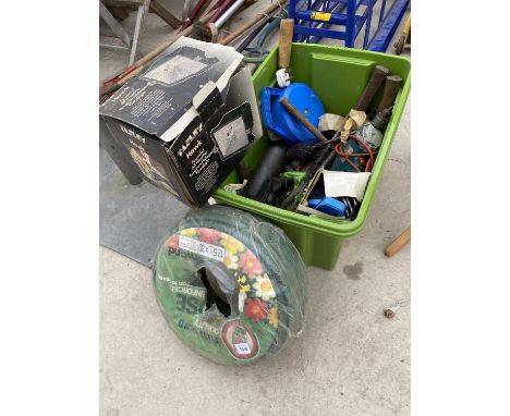 AN ASSORTMENT OF TOOLS TO INCLUDE AN AXE, A HOSE PIPE AND A BOTTLE JACK ETC 