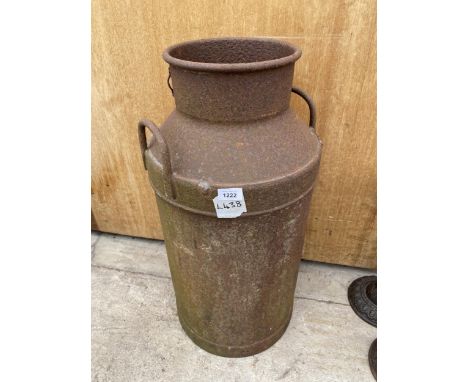 A VINTAGE CAST IRON MILK CHURN (CORROSION TO BASE) 