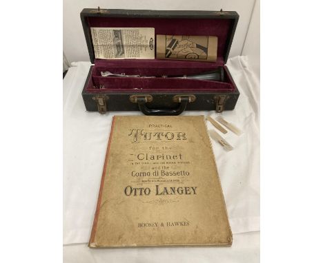 A BOXED BOOSEY AND HAWKES CLARINET 77 BOEHM SYSTEM WITH SPARE REEDS AND 'PRACTICAL TUTOR FOR THE CLARINET' BOOK 