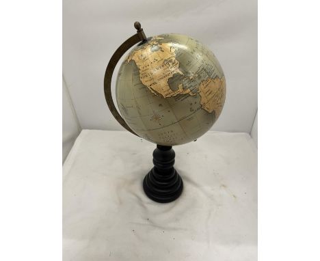 A WORLD GLOBE ON A WOODEN STAND HEIGHT 40CM 