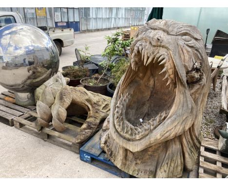 A LARGE CHAINSAW CARVING OF A BEACH MONSTER ENTITLED 'THE MOUTH' 