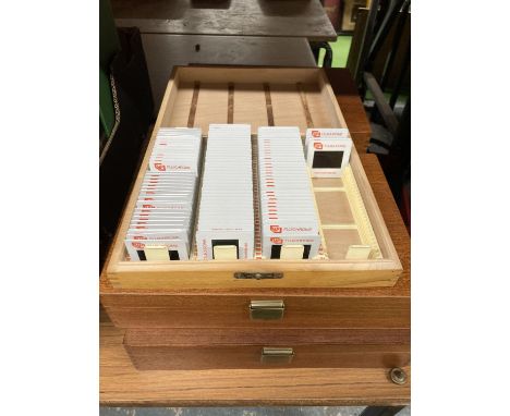 A QUANTITY OF VINTAGE FAMILY SLIDES CASED IN FIVE WOODEN BOXES 