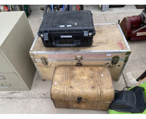 A WOODEN TRUNK CONTAINING WHEELS ETC, A TIN CHEST AND A NOISE SYSTEM KIT CASE 
