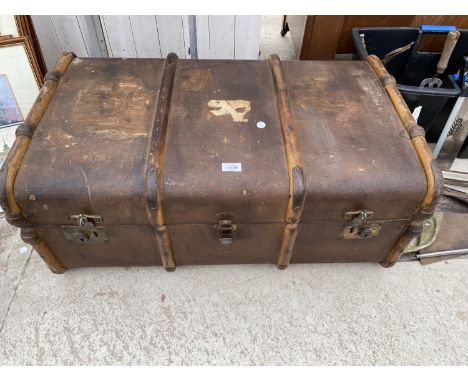 A LARGE VINTAGE TRAVEL TRUNK 