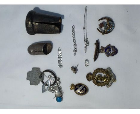 A BAG OF SCRAP SILVER AND ARMY BADGES 