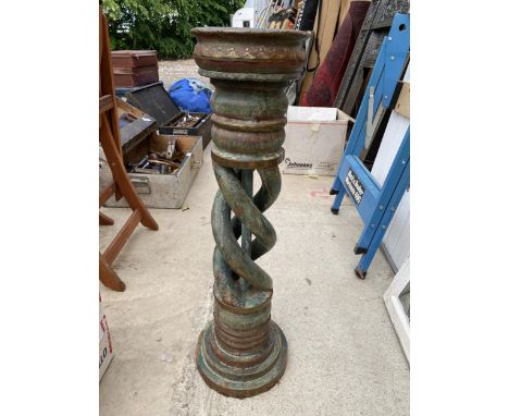 A WOODEN PEDESTAL PLANT STAND 