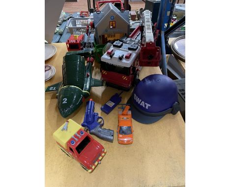 A VARIETY  OF TOY VEHICLES TO INCLUDE A FIRE ENGINE, SPIDER MOBILE, AMBULANCE, AEROPLANE TOGETHER WITH A FIREMAN SAM FIRE STA