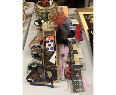 A QUANTITY OF HABERDASHERY ITEMS TO INCLUDE BUTTONS, RIBBONS, ELASTIC ETC, PLUS A VINTAGE TIN 