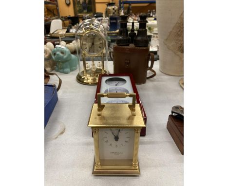 AN ANNIVERSARY CLOCK IN A DOME, A CARRIAGE CLOCK, A PAIR OF SMALL BINOCULARS, ETC 