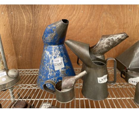 AN ASSORTMENT OF VINTAGE OIL JUGS 