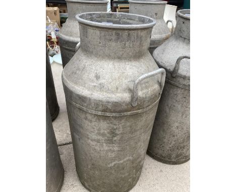 A VINTAGE MILK CHURN 
