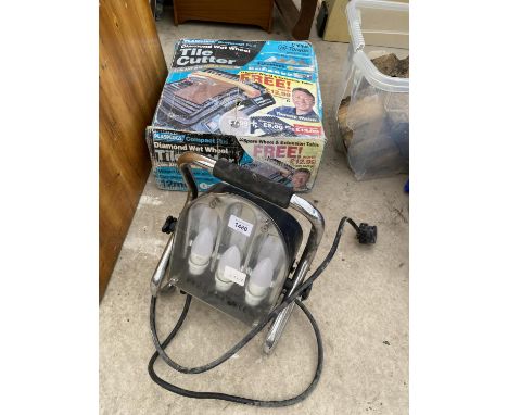 A PLASPLUGS TILE CUTTER AND A SPOTLIGHT 