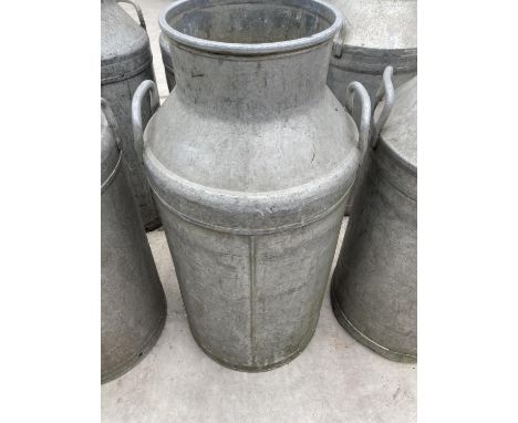 A VINTAGE MILK CHURN 
