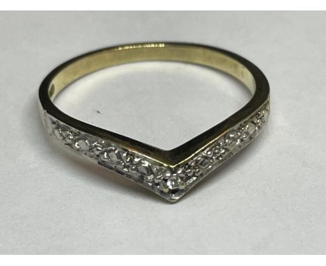 A 9 CARAT GOLD RING WITH DIAMONDS IN A WISHBONE DESIGN SIZE K 