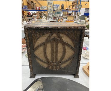 A 'CELESTION' VINTAGE RADIO IN AN OAK CASE 