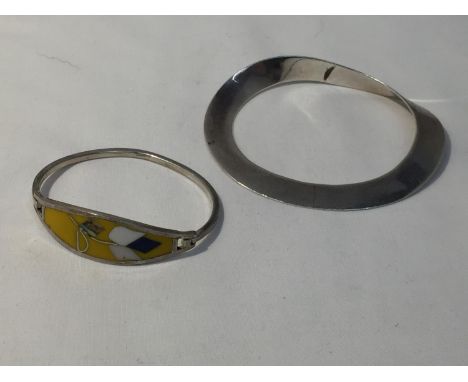 TWO SILVER BANGLES ONE MARKED AND WITH AN ENAMEL DESIGN 
