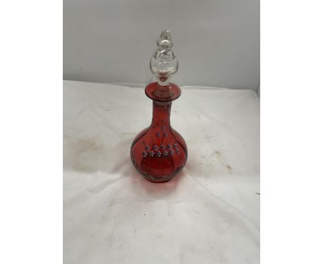 A CRANBERRY AND ENAMEL GLASS DECANTER WITH FLOWER DECORATION HEIGHT 26CM 