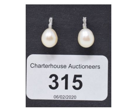 A pair of 9ct gold, diamond and pearl earrings

 