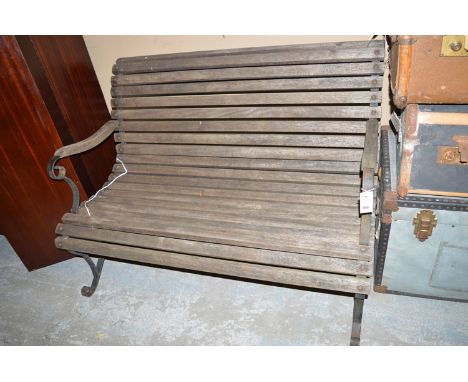A wooden garden and metal bench.