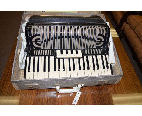 A Cook L'Armonica Stradella piano accordion in case.
