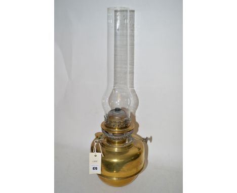 A brass oil lamp.
