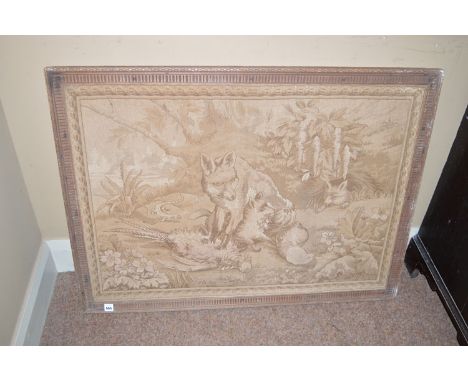 A framed tapestry depicting a vixen and her cubs.