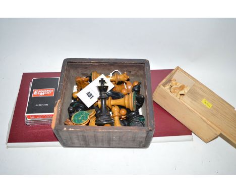 Two wooden chess sets; two sets of playing cards; and a draughts board.
