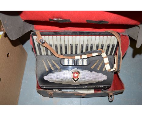 A piano accordion by Crucianelli, in fitted case.