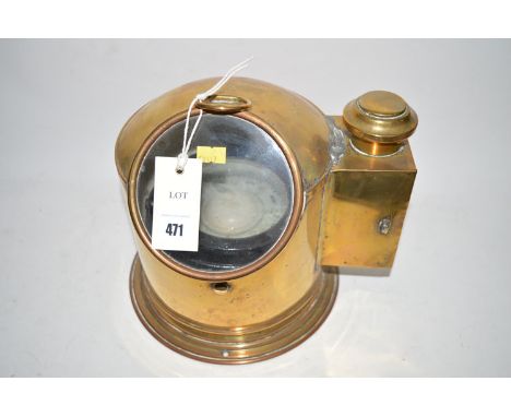 A boat's brass binnacle and compass.