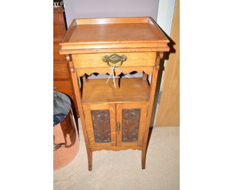 A small late 19th Century bedside cupboard, the rectangular top with raised gallery with shallow drawer below over an open sh