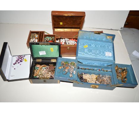 A large quantity of costume jewellery, to include: a light blue glass and gilt metal pendant, a plated swimming medallion, a 