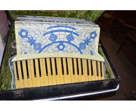 A Scott-Wood six Scandalli piano accordion in case.