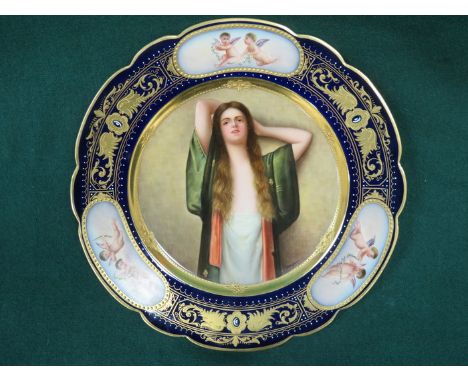 ROYAL VIENNA HANDPAINTED AND GLIDED CERAMIC PLATE SIGNED WAGNER. APPROX 23cm DIAMETER