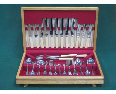 MODERN LIGHT OAK CASED CANTEEN OF CUTLERY BY GILPN LIMITED