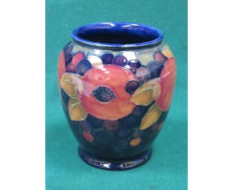 MOORCROFT POMEGRANATE PATTERN TUBE LINED CERAMIC VASE, INITIALED TO THE BASE AND NUMBERED 348. APPROX 16cm HIGH