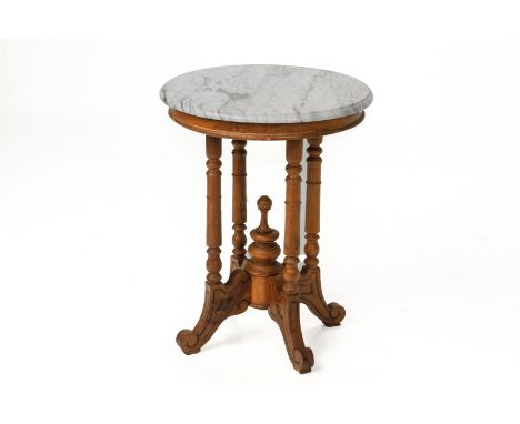 A CIRCULAR MARBLE TOP TEAK OCCASIONAL TABLE
On turned supports and scroll feet
50cm diameter; 65cm high
Condition: For a cond