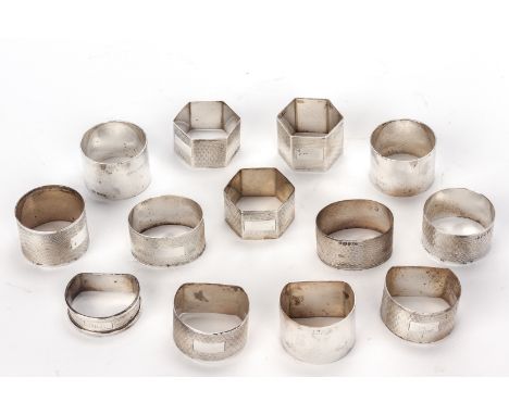 A GROUP OF 13 ENGLISH SILVER NAPKIN RINGS
12 by Viners Ltd, Sheffield 1959/1960; one Henry Griffith &amp; Sons, Birmingham 19