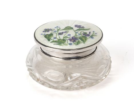 A SILVER AND ENAMEL TOPPED CUT GLASS DRESSING TABLE POT
By Joseph Gloster Ltd, Birmingham 1949
The cover decorated with purpl