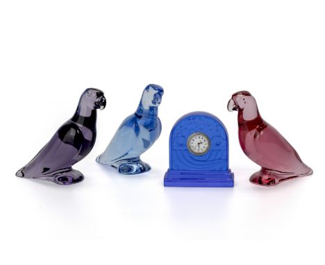 A GROUP OF BACCARAT CRYSTAL ITEMS
Comprising: three parrots, in varying colours, and a small bedside clock (movement not work