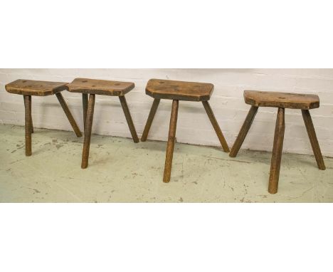 SHEFFIELD CUTLERS STOOLS, four similar early 19th century Yorkshire ash and elm with tripod supports (two initialled to under