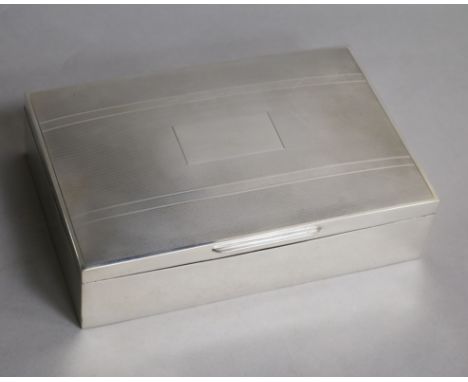 A 1960's engine turned silver rectangular cigarette box, Birmingham, 1964, 17cm.