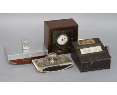 A metal address book, clocking in clock and two blotters