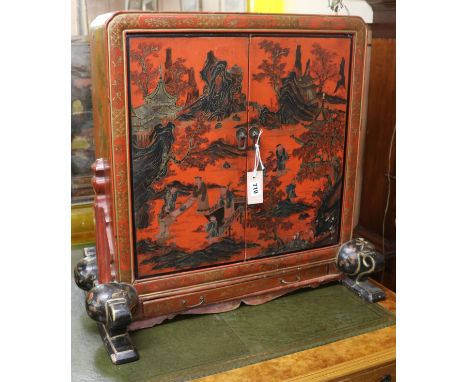 A 19th century Chinese red lacquer scroll cabinet W.70cm