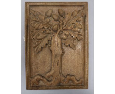 An early 18th century oak panel, carved with an oak tree and acorns 33 x 24cm
