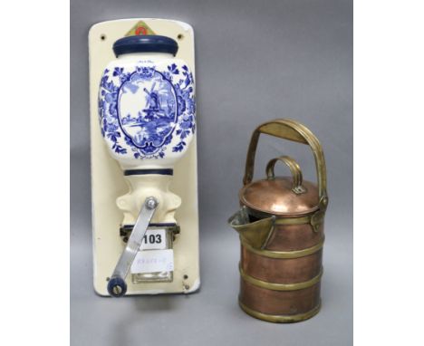 A Delft wall mounted coffee grinder and a copper and brass covered jug longest 34cm