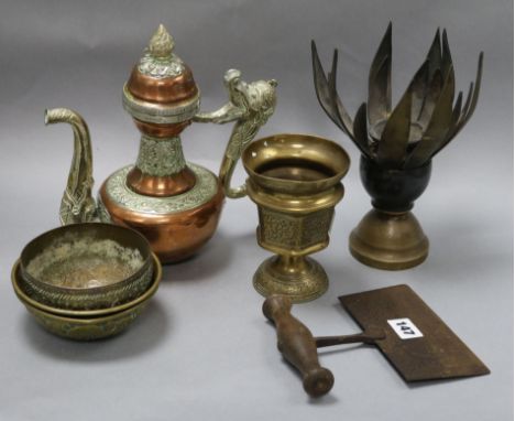 A collection of Indian and Tibetan brassware including a lotus shaped incense burner and a Tibetan teapot tallest 25cm