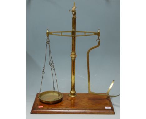 A Victorian brass beam scale on walnut plinth 