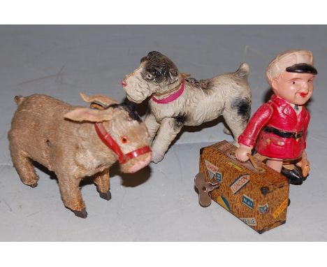 A Shuco mohair model of a donkey, together with two other clockwork toys Condition Report / Extra Information Celluloid trave