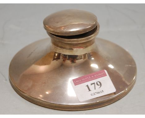 A silver capstan inkwell 